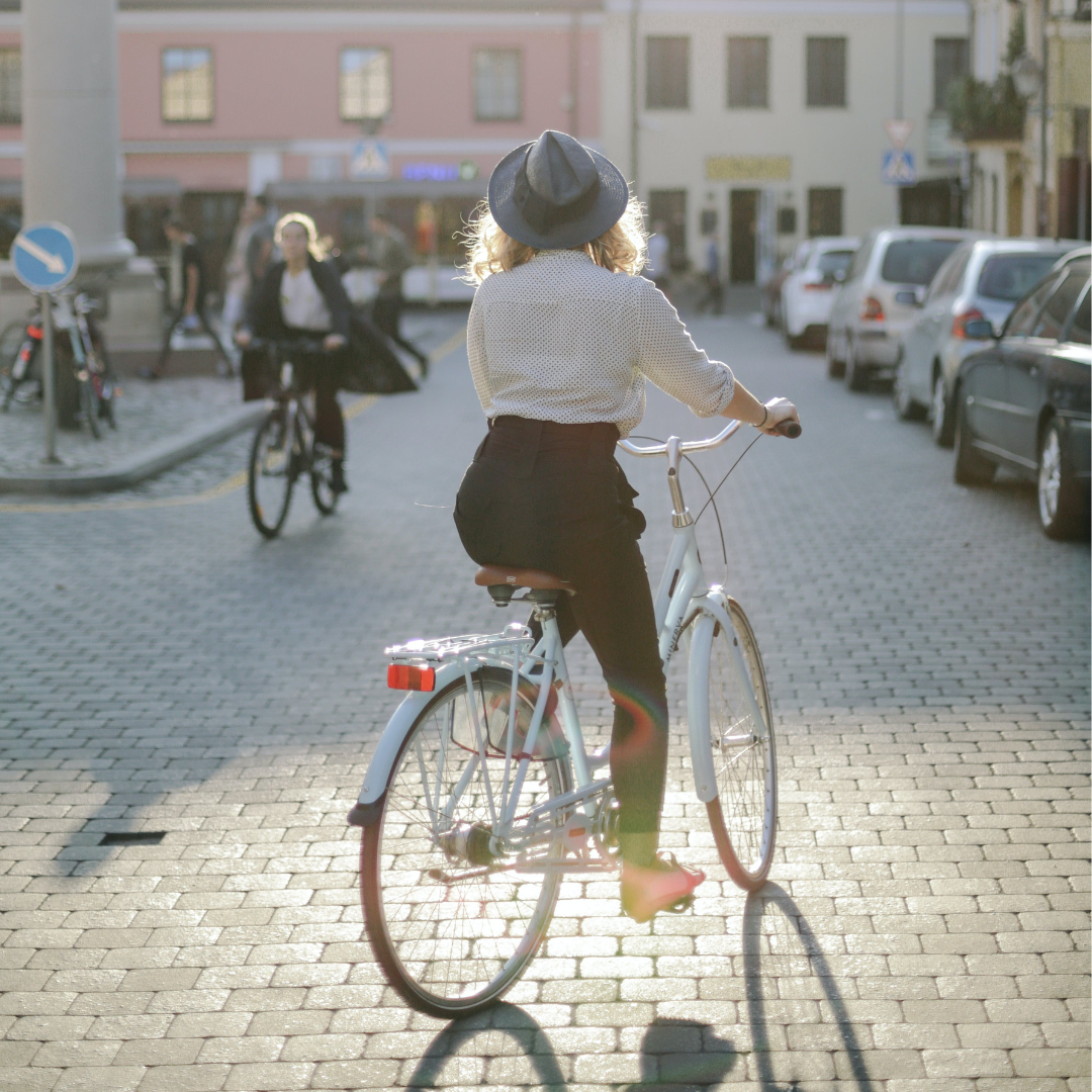 A women cycling in the road